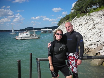 My hot wife and I in wetsuits.
