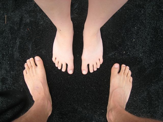 Our feet on the new black sand beach